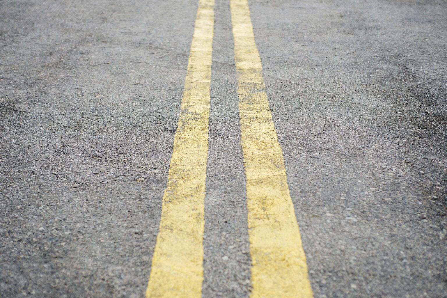 bigstock-yellow-double-solid-line-road-390104578-alternatives-medical