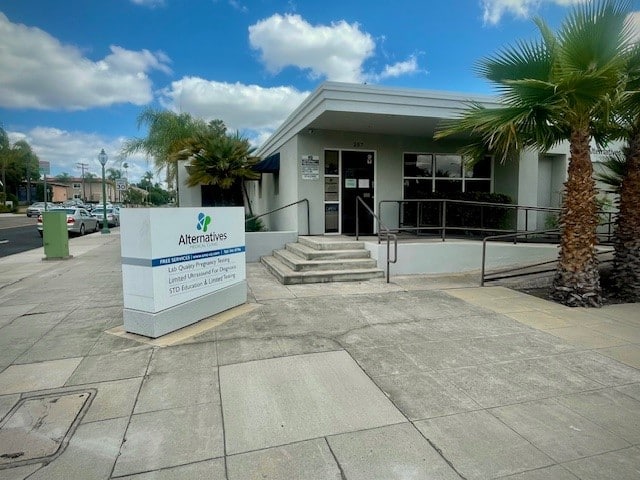 Exterior of the Alternatives outpatient treatment center with accessible entrance, ramp, and facility sign.